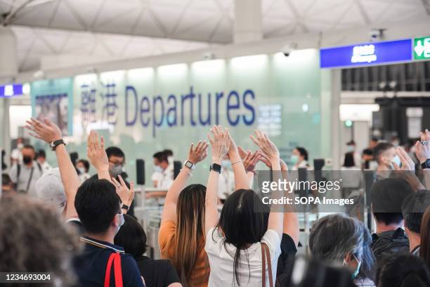 People seen saying goodbye to friends and family at Hong Kong international airport as they emigrate to other countries. Hong Kong government has...