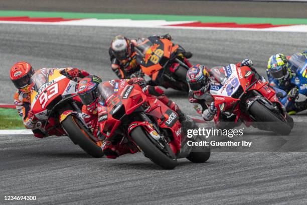 Marc Marquez of Spain and Repsol Honda Team, Francesco Bagnaia of Italy and Mission Winnow Ducati Team and Jorge Martin of Spain and Pramac Racing...