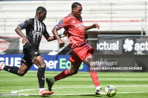Lyon's Brazilian defender Marcelo fights for the ball with Angers' French forward Mohamed-Ali Cho during the French L1 football match between Angers...
