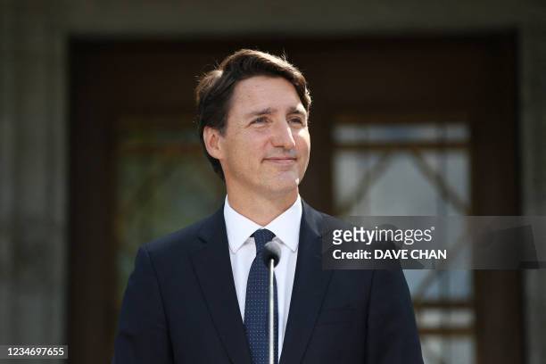 Canada's Prime Minister Justin Trudeau smile during a news conference at Rideau Hall after asking Governor General Mary Simon to dissolve Parliament...