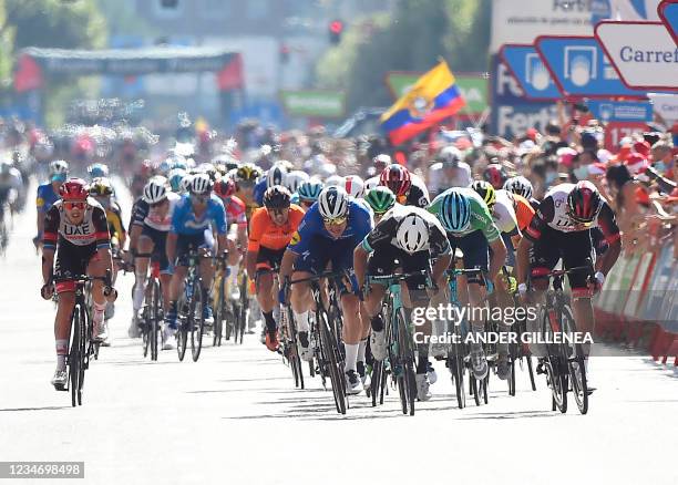 Riders sprint ahead of the finish line during the 2nd stage of the 2021 La Vuelta cycling tour of Spain, a 166,7km race from Caleruega to Burgos, on...