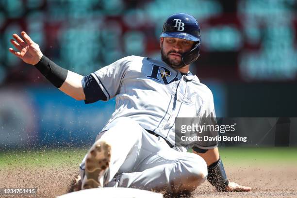 Mike Zunino of the Tampa Bay Rays slides safely into third base against the Minnesota Twins in the third inning of the game at Target Field on August...