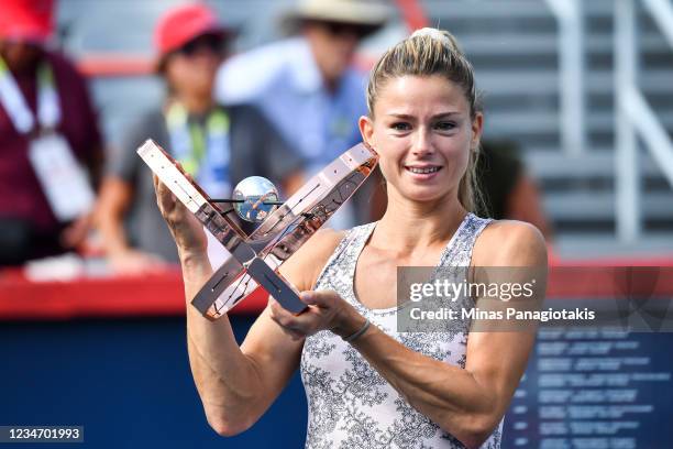 Camila Giorgi of Italy poses with the winners trophy after defeating Karolina Pliskova of the Czech Republic during her Womens Singles Final match on...