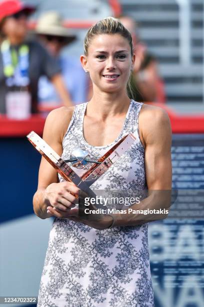 Camila Giorgi of Italy poses with the winners trophy after defeating Karolina Pliskova of the Czech Republic during her Womens Singles Final match on...