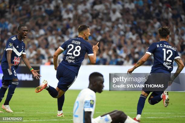 Bordeaux's French forward Remi Oudin celebrates scoring his team's second goal during the French L1 football match between Olympique de Marseille and...