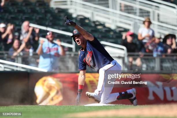 Max Kepler of the Minnesota Twins celebrates after hitting a triple against the Tampa Bay Rays in the ninth inning of the game at Target Field on...