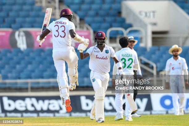 Jayden Seales and Kemar Roach of West Indies celebrate winning on day 4 of the 1st Test between West Indies and Pakistan at Sabina Park, Kingston,...