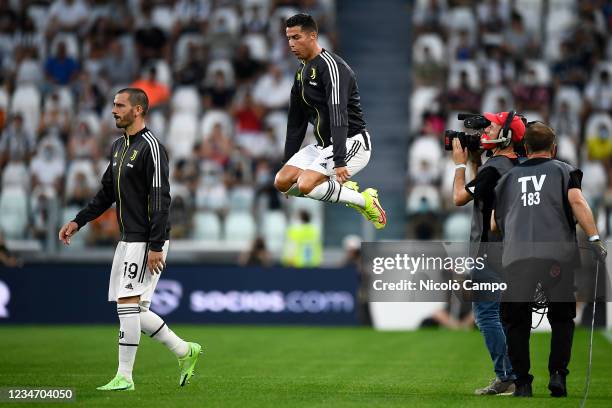 Cristiano Ronaldo of Juventus FC jumps after entering the pitch prior to the friendly football match between Juventus FC and Atalanta BC. Juventus FC...