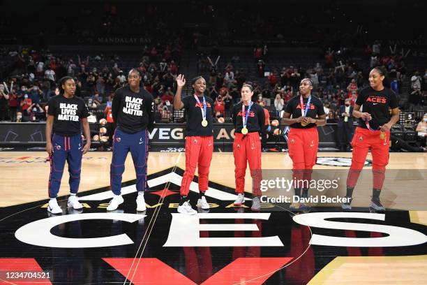 Gold Medal recipients Jackie Young, Kelsey Plum, Chelsea Gray, A'ja Wilson of the Las Vegas Aces, Ariel Atkins and Tina Charles of the Washington...