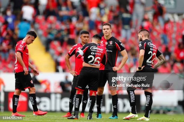 Franco Troyansky, Julio Furch and Aldo Rocha of Atlas react after losing the 4th round match between Atlas and America as part of the Torneo Grita...