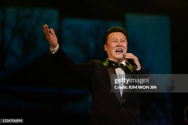 Singer of the Mansudae Art Troupe performs during celebrations as North Korea marks its 76th National Liberation Day, commemorating the end of...