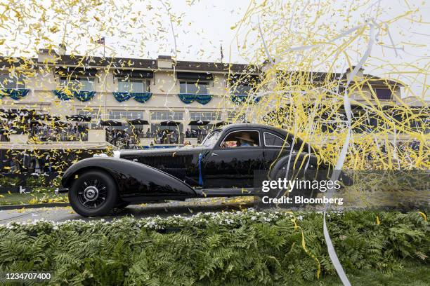 Arturo and Deborah Keller drive onto the winners ramp after winning the Best of Show award with their 1938 Mercedes-Benz 540K Autobahn Kurier at the...