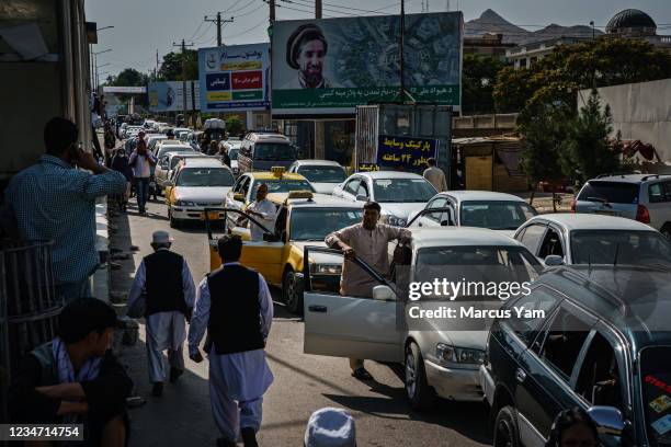 Pedestrians, motorists ended up in a traffic grid lock as the Afghans rush to safety with the uncertainty and rumor swirling that Taliban enter the...