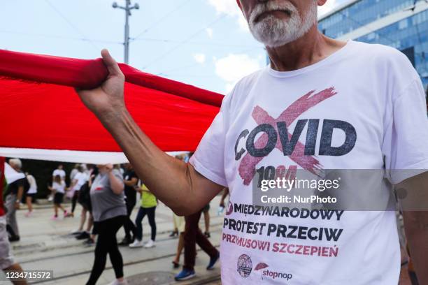 Anti-vaccination coronavirus sceptics attend Silesian Freedom March in Katowice, Poland on August 7th, 2021. Demonstrators gathered to protest...