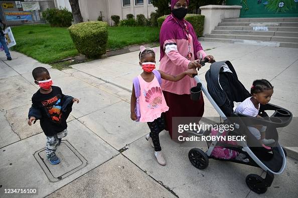 Zeidy Ritchy Zeidy and his sister Kadi arrive with their mother Fatou Drame for ...