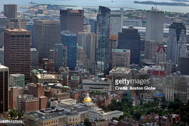 An aerial view of downtown Boston with the Massachusetts State House lower in the foreground on July 28, 2021.