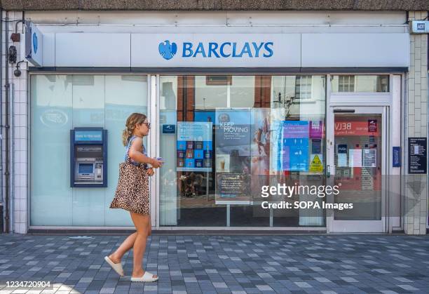 Lady walks past Barclays Bank on Bow Street in Lisburn.