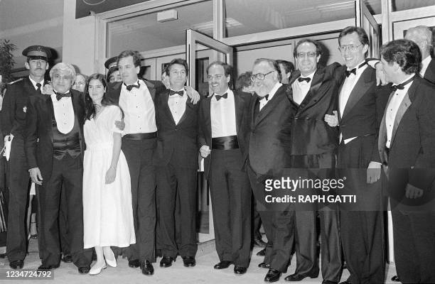 Italian film director Sergio Leone accompanied by actors Burt Young , Jennifer Connelly , Danny Aiello , Robert de Niro , James Woods , and Joe Pesci...