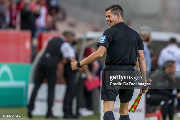 Referee Assitent Robert Kempter gestures during the DFB Cup first round match between 1. FC Kaiserslautern and Bor. Moenchengladbach at...