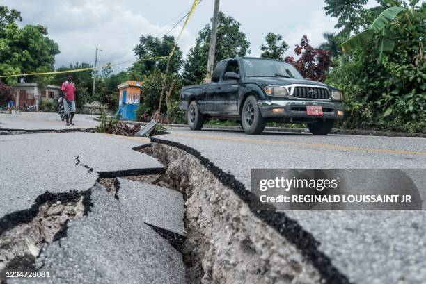 The severely damaged road to Camp-Perrin leading to Jeremie, is viewed after the earthquake near Camp-Perrin, Haiti on August 16, 2021. - Rescuers in...