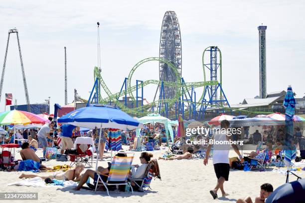 Visitors at a beach in Seaside Heights, New Jersey, U.S., on Sunday, Aug. 15, 2021. On Monday, New Jersey reported another 1,145 confirmed COVID-19...