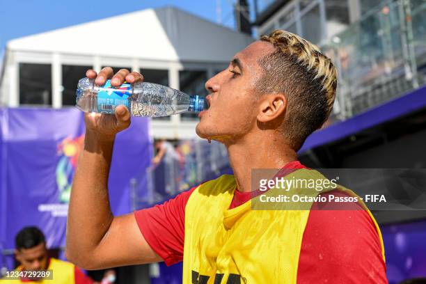 Heirauarii Salem of Tahiti drinks water and refreshes his face during a training session prior to the FIFA Beach Soccer World Cup Russia 2021 on...