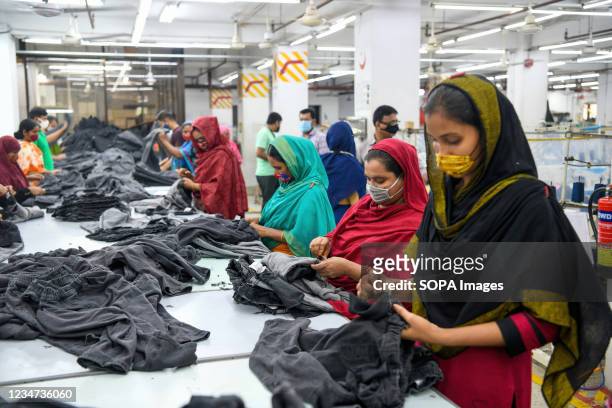 Ready-Made Garment workers wearing face masks during their work as a precaution against the spread of coronavirus, at The Civil Engineering Limited...