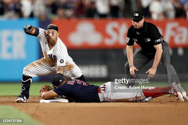 Rougned Odor of the New York Yankees reacts after being called safe at second base ahead of a tag by Xander Bogaerts of the Boston Red Sox in the...