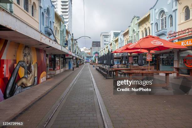 Closed restaurants and shops are seen in an empty street in Christchurch, New Zealand, on August 18, 2021. New Zealand moved to alert level four from...