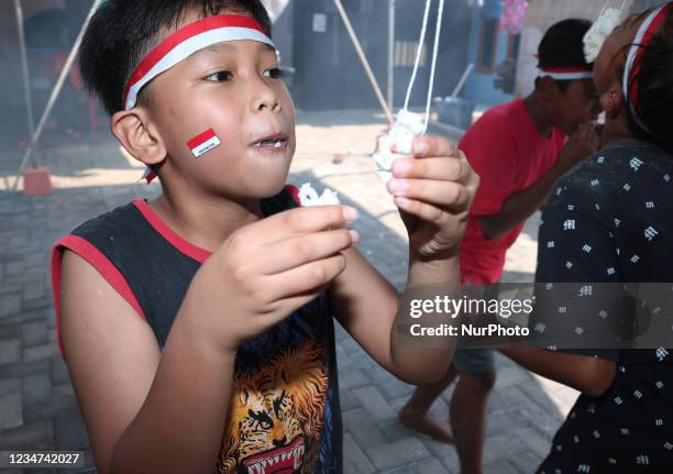 A children compete in the traditional child game while celebrating the 76th Indonesian independence day at the yard in Pandawangi Village, Malang,...