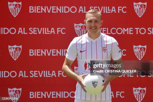 Sevilla's newly signed Swedish defender Ludwig Augustinsson attends his official presentation by the Spanish football club in Seville on August 18,...