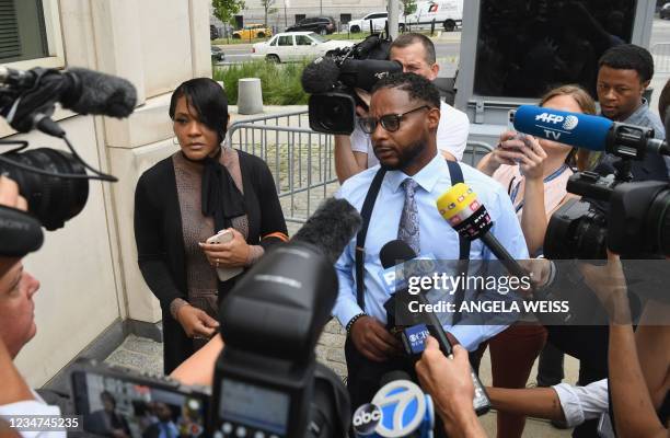 Timothy Savage and Jonjelyn Savage, parents of victim Jocelyn Savage, speak to the media as they arrive to attend the trial in the racketeering and...