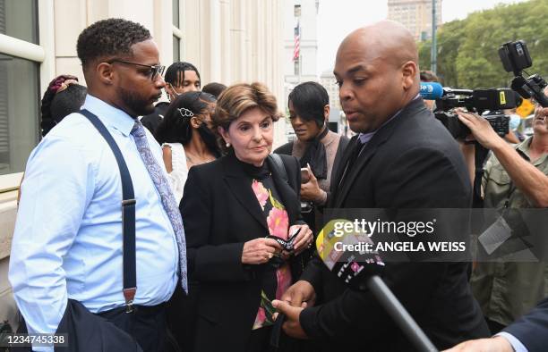 Attorney Gloria Allred speaks to the media as Timothy Savage, father of victim Joycelyn Savage listens, as they arrive to attend the trial in the...