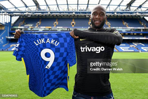 Romelu Lukaku of Chelsea holds his number 9 shirt after a training session at Stamford Bridge on August 18, 2021 in London, England.