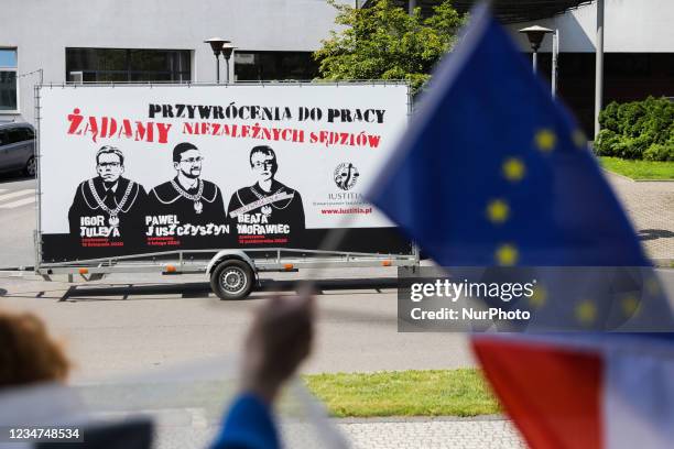 Banner with cartoons of suspended Polish judges is seen during a rally in front of a court in support of judical indepencence in Poland. Krakow,...