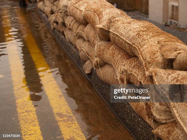 flood defences - sandbag stock pictures, royalty-free photos & images