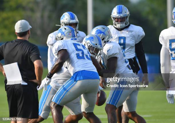 Detroit Lions defensive players run strip drills during practice at Detroit Lions Training Camp on August 17, 2021 at Lions Practice Facility in...