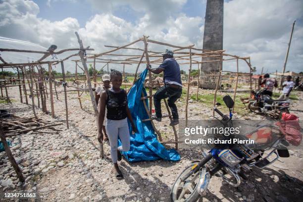 Haitians begin the work of recovering after a 7.2-magnitude earthquake struck the country on August 18, 2021 in Les Cayes, Haiti. Rescue efforts...