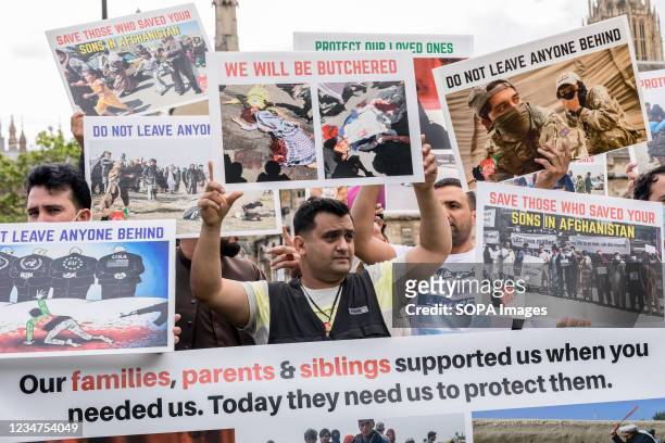 Protesters hold placards expressing their opinions during the demonstration. In light of the recent seizure of Following the recent seizure of...