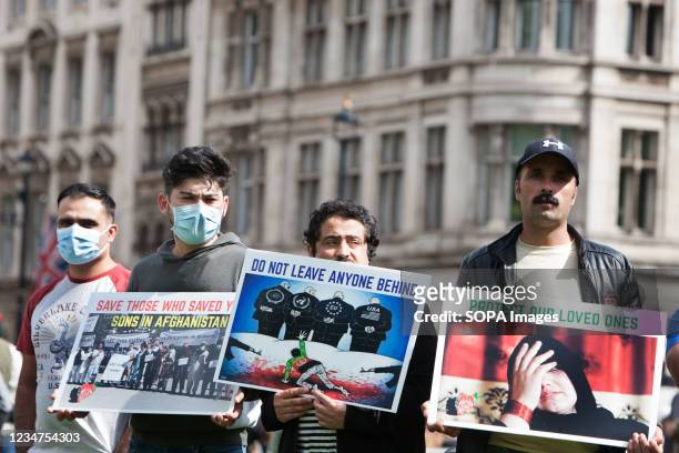 Protesters holding anti-Taliban placards, during the demonstration. Protesters including former interpreters for the British Army gathered in...