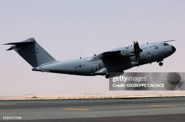 Royal Air Force Airbus A400M Atlas military transport aircraft, carrying evacuees from Afghanistan, departs from Al-Maktoum International Airport in...