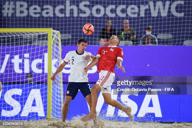 Fedor Zemskov of Football Union Of Russia and Chris Albiston of USA in action during the FIFA Beach Soccer World Cup 2021 group A match between...