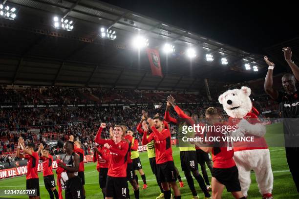 Rennes' players celebrate after winning in the Conference Europa league football match between Rennes and Rosenborg at the Rohazon Park Stadium in...