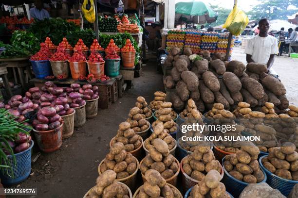 Trader display farm produce at Wuse Market, Abuja, Nigeria, on August 17, 2021. - Threatened by insecurity, farmers in Nigeria's farm belt are...