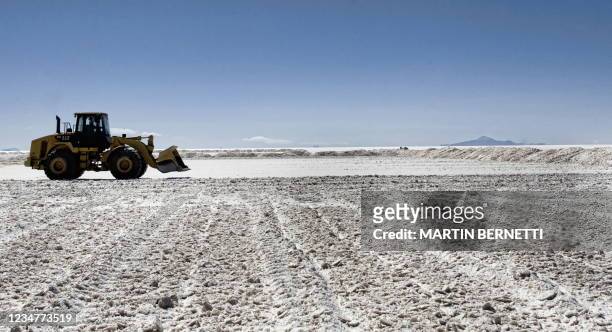 An excavator piles up salt at the Uyuni Salt Flats in Bolivia, October 10, 2009. The Uyuni Salt flats has one of the biggest reserves of lithium in...