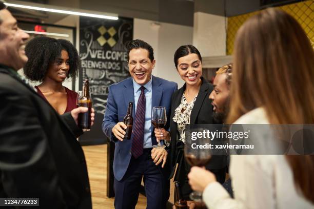 work colleagues enjoying after hours office party - miami party stock pictures, royalty-free photos & images