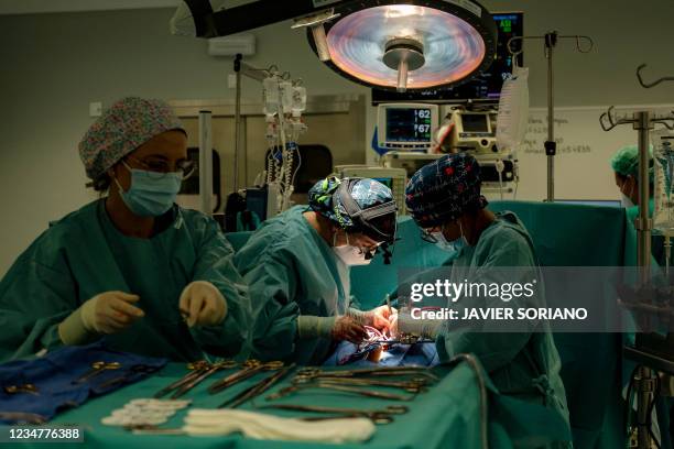 Cardiovascular surgeons Susana Villar and Elsa Rios prepare a patient to receive a new heart from a donor at an operating theatre in Puerta de Hierro...