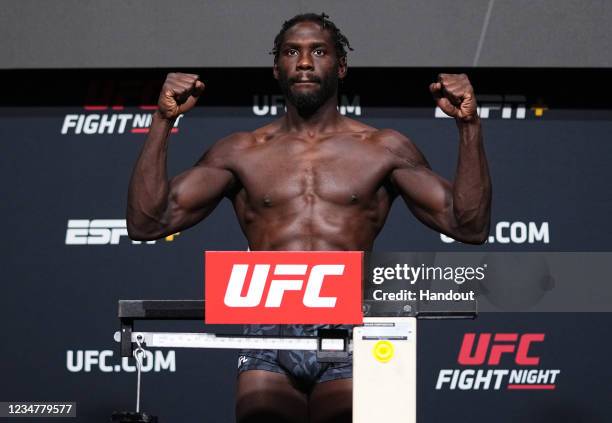 In this UFC handout, Jared Cannonier poses on the scale during the UFC Fight Night weigh-in at UFC APEX on August 20, 2021 in Las Vegas, Nevada.