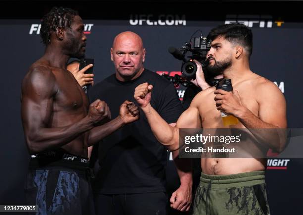 In this UFC handout, Opponents Jared Cannonier and Kelvin Gastelum face off during the UFC Fight Night weigh-in at UFC APEX on August 20, 2021 in Las...