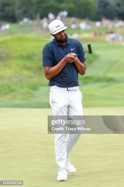 Tony Finau looks down the line of his putter at the 17th hole during the second round of THE NORTHERN TRUST at Liberty National Golf Club on August...